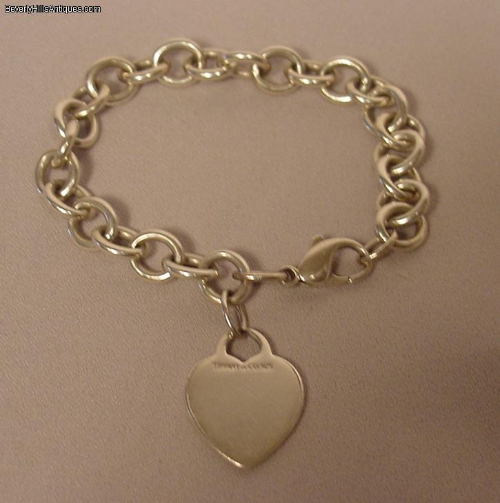 Tiffany & Co. Sterling Silver Heart Tag Charm Bracelet For Sale | 0 | Classifieds