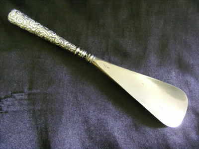 A antique solid sterling silver handled 
